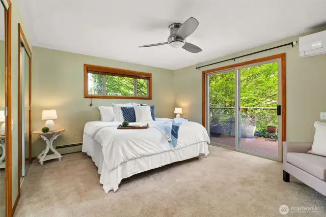 Primary bedroom with two closets, views of the water and an energy efficient mini-split.