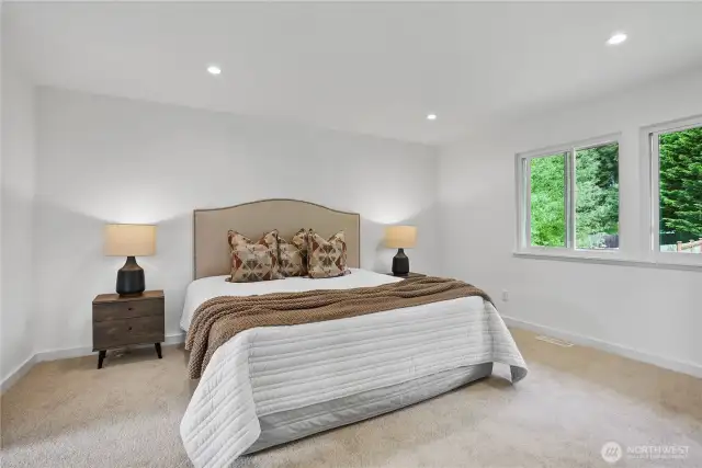 Primary bedroom suite with walk-in closet and designer bathroom