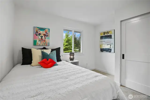 Second bedroom on upper level, just down the hall from primary bedroom
