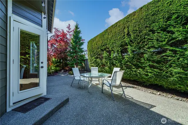 Step outside to an expansive and private patio with multiple seating areas for relaxing or entertaining.