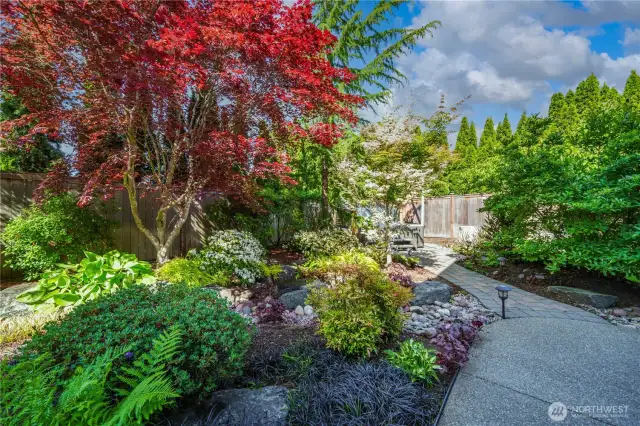 Follow the paver pathway to the spa area of the yard—another thoughtfully designed space to unwind.
