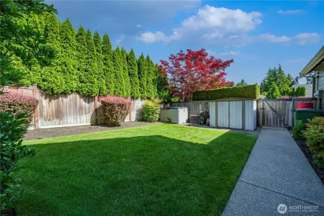 On the east side of the home, you’ll find a grassy area perfect for play, plus two storage sheds for all your tools and toys.