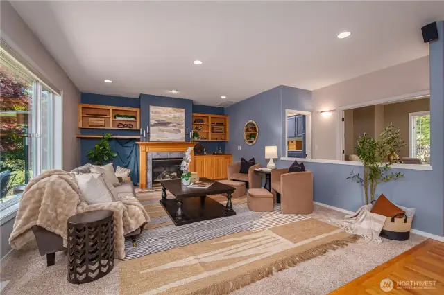 The cozy family room includes built-ins and a gas fireplace, creating a welcoming space to relax and gather.