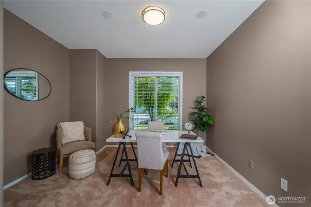 A generously sized main-floor office or den offers the perfect place to work from home or enjoy a quiet retreat.