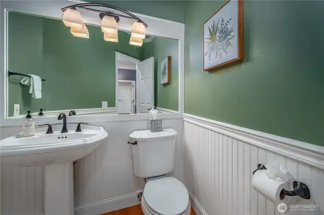 This main-floor powder room is tastefully updated and conveniently located.