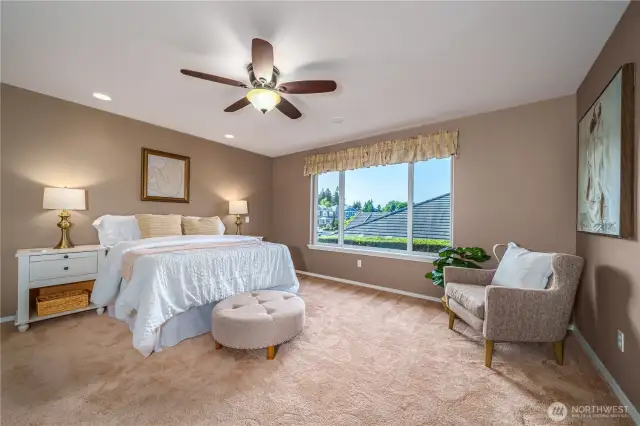 There’s plenty of room to spread out in this comfortable and well-designed primary bedroom.