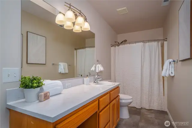The full bath boasts new countertops and flooring and a brand-new toilet.