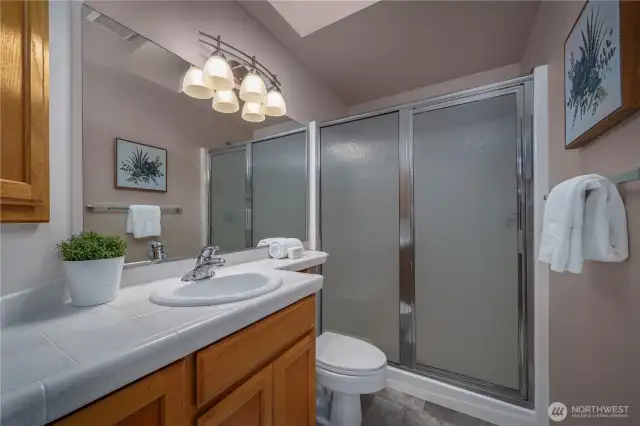 The additional three-quarter hall bath features brand-new flooring.