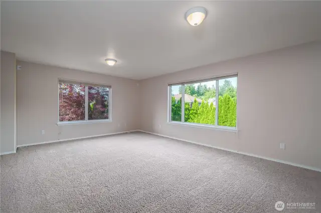 At the end of the hallway, you’ll find a massive bonus room perfect for a media room, home gym, or flexible living space.