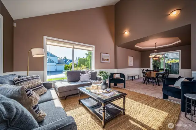 The living room flows seamlessly into the formal dining room, creating an open and inviting space for entertaining.