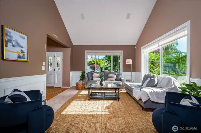 This view looks back toward the formal living room and the bright, welcoming entryway.