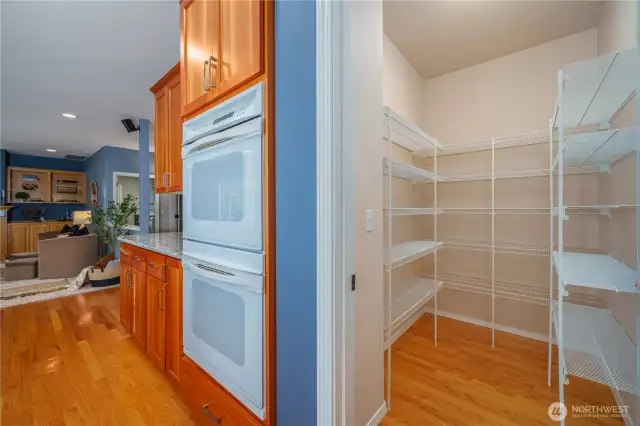 Don’t miss the spacious walk-in pantry complete with custom shelf organizers.
