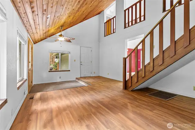 Living Room and entry way looking from bonus room
