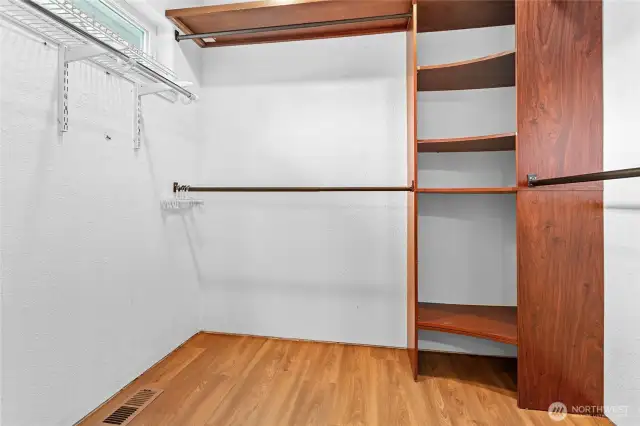 Primary bedroom walk in closet
