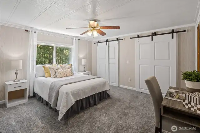 Primary Bedroom with barn door closet doors!