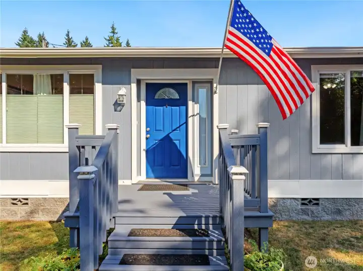 A blue door welcomes you into the home.