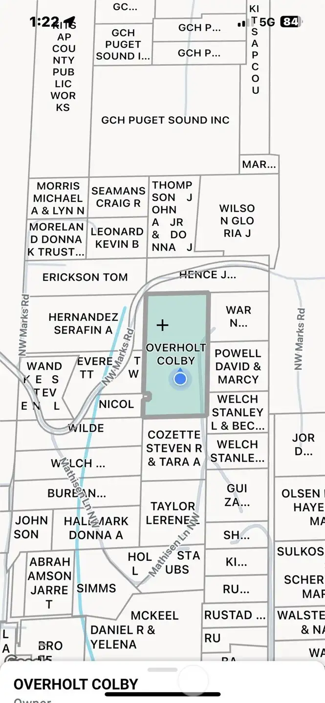 For Sale sign and easiest way to access the property is from Mathisen Land NW.