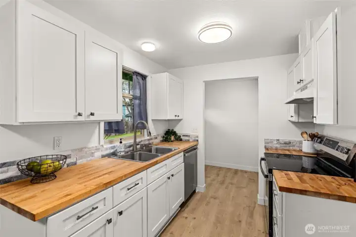 Galley Kitchen with Butcher Block Counters