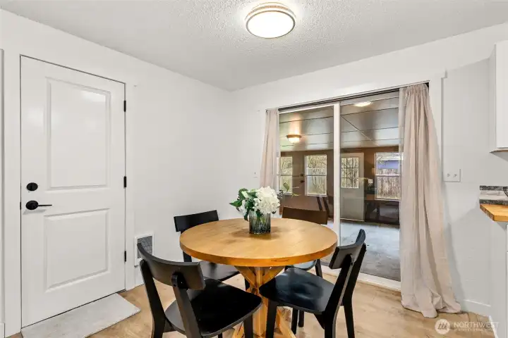 Dining Room leading into enclosed extra bonus game room/craft room/or outdoor living space.