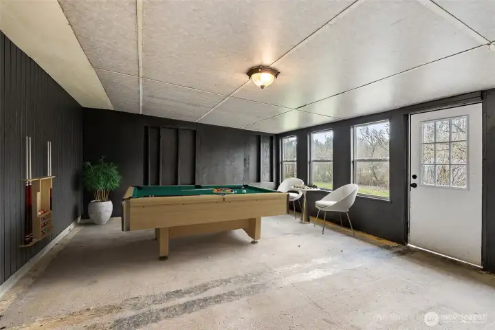 Enclosed Bonus Space GAME ROOM. DIGITALLY STAGED.