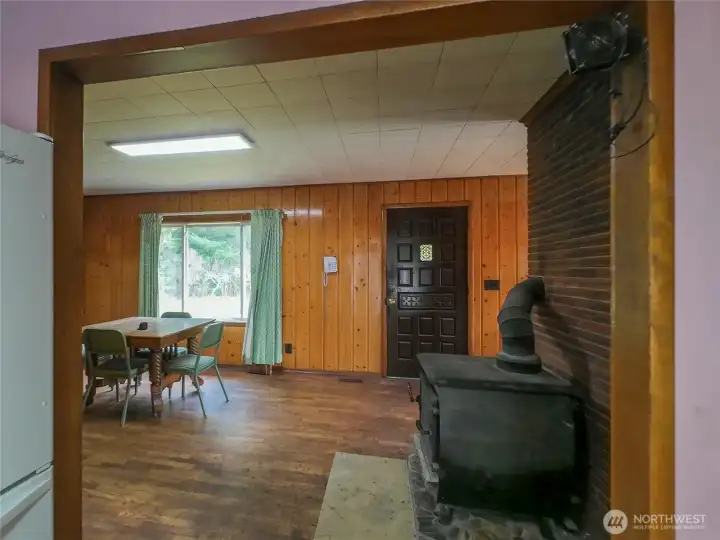 Formal entry, dining and that fabulous wood stove to heat the back of the house. Also has central oil heat.