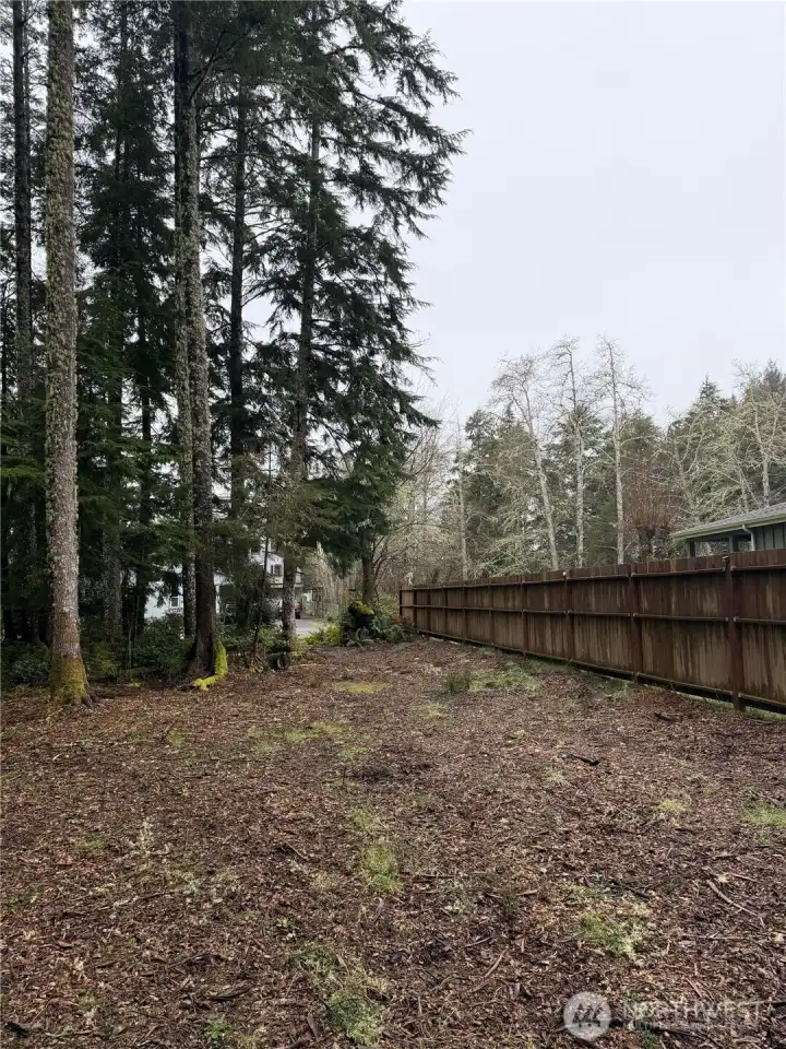 Looking towards from of lot and driveway,  Privacy fence!