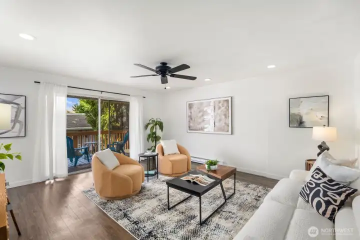 Spacious living room leads to private covered deck.