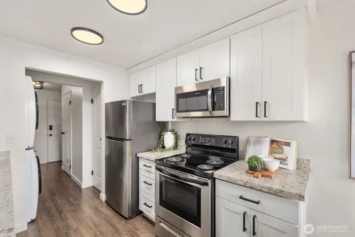 Updated chef's kitchen with stainless steel appliances.