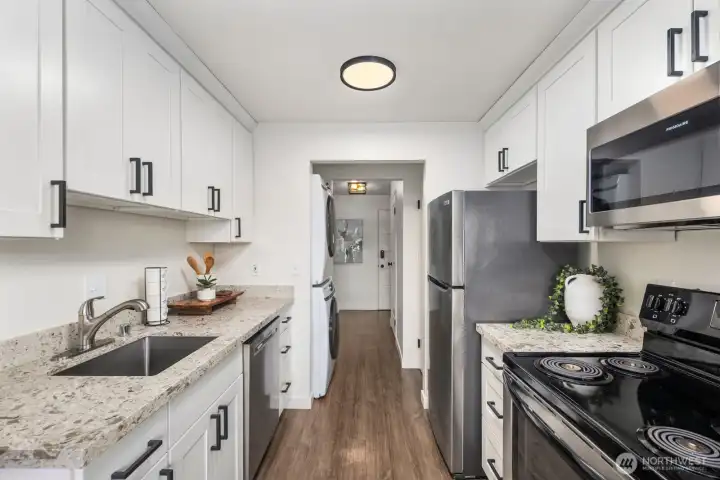 Updated chef's kitchen with stainless steel appliances.