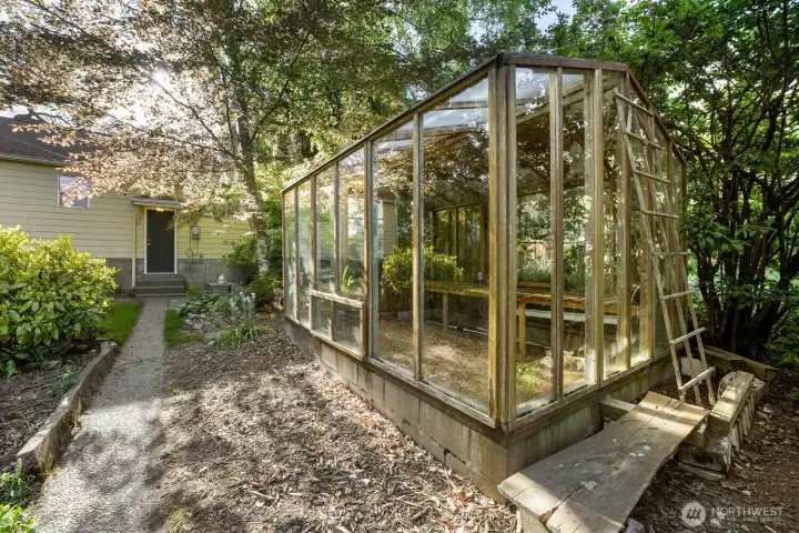 a former chicken coop that can function as a future green house.