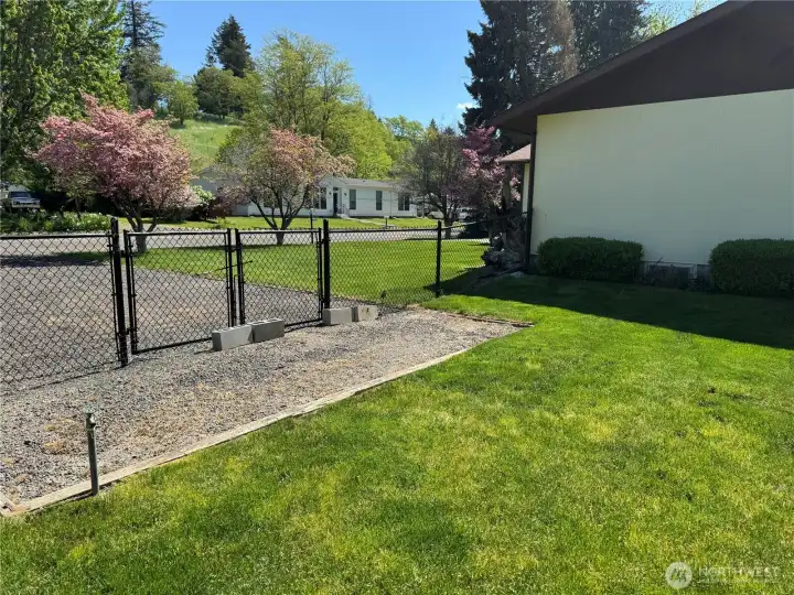 New Fence And Additional Gravel Parking.