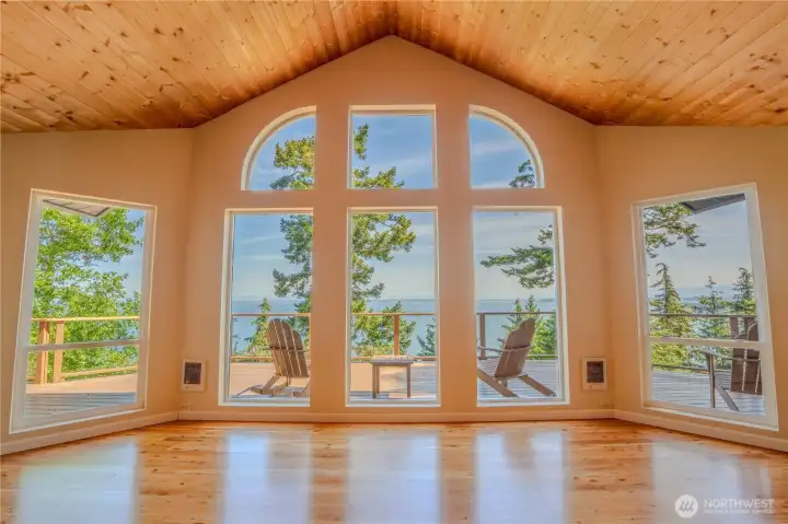 The great room frames sweeping northern water views.