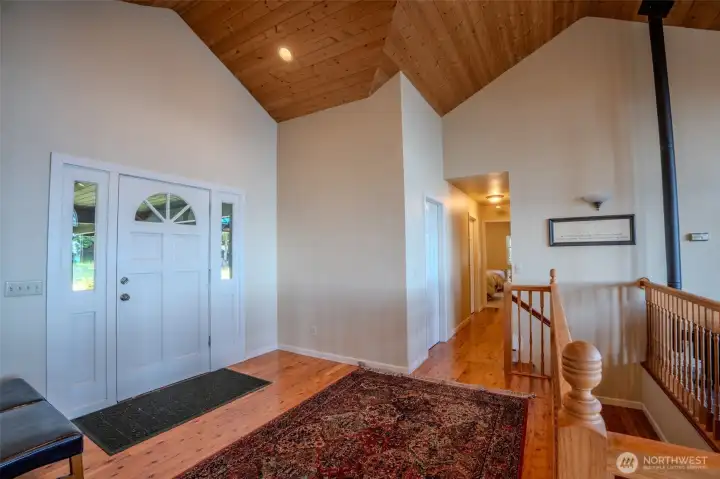 The entry opens to an airy great room with abundant windows and natural light.