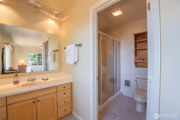 Primary bathroom featuring a convenient step-in shower.