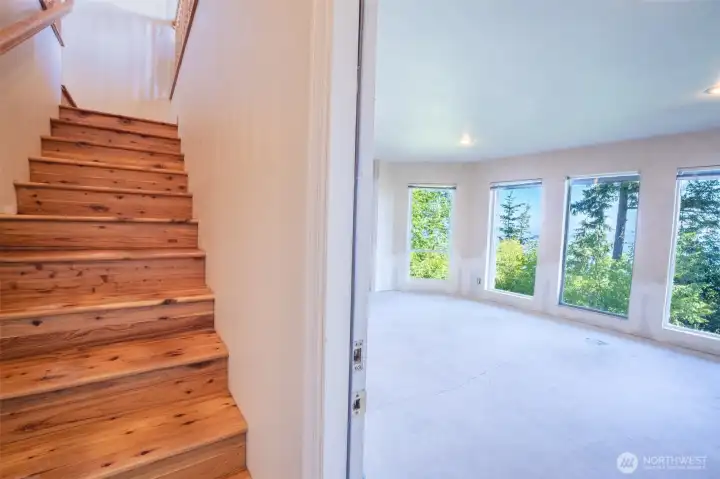 Interior stairs lead to the spacious daylight lower level.