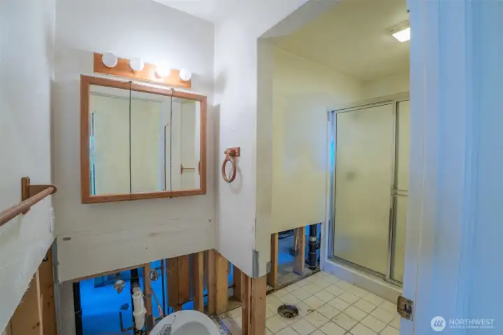 Lower-level 3/4 bathroom ready for toilet installation.