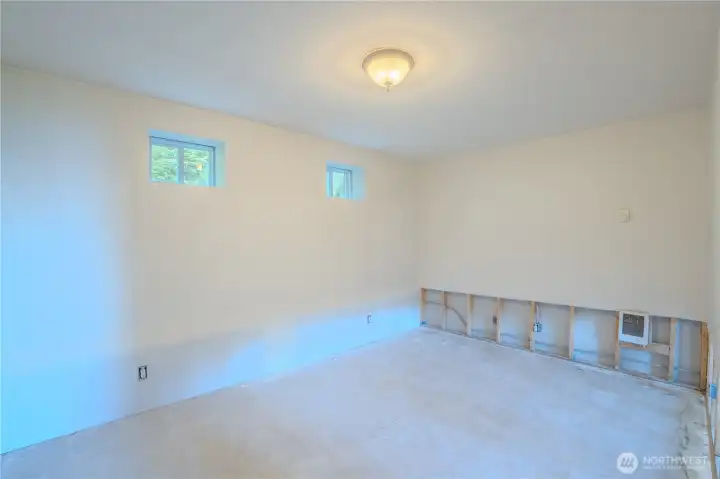 Another lower-level bonus room offering room for guests, work, or creative use.
