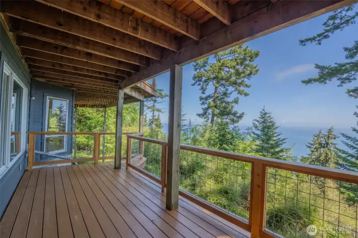 Separate lower-level entrance opens to its own deck.