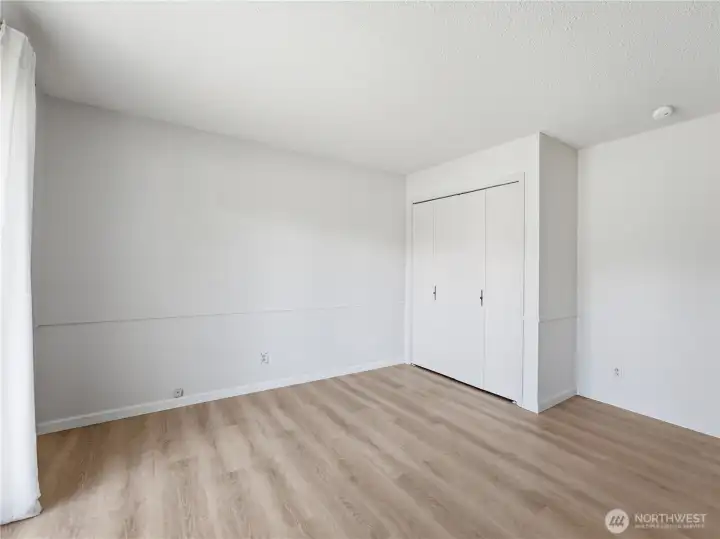 Comfortable guest bedroom filled with natural light. Comfortable guest bedroom filled with natural light.