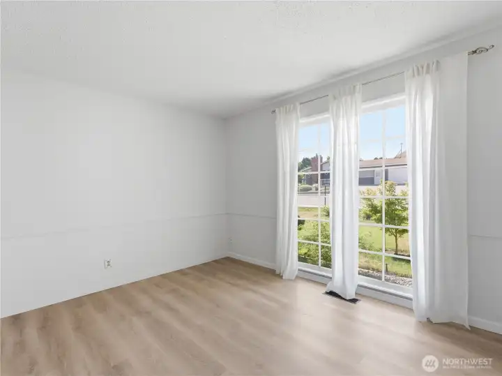 Comfortable guest bedroom filled with natural light. Comfortable guest bedroom filled with natural light.