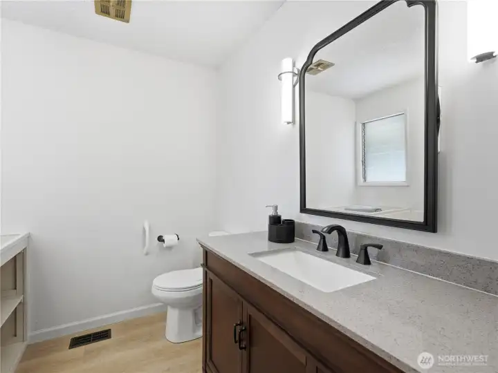Well-appointed full bathroom serving guests and secondary bedroom. Well-appointed full bathroom serving guests and secondary bedroom.