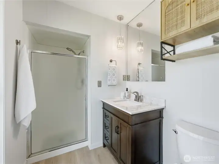 Clean, functional ensuite with timeless design and step-in shower. Clean, functional ensuite with timeless design and step-in shower.