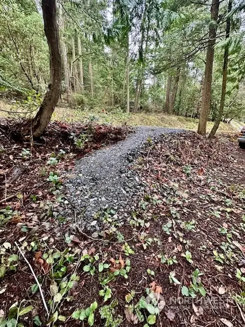 Gravel path off Killebrew Lake Road to ramp, stairs to beach.