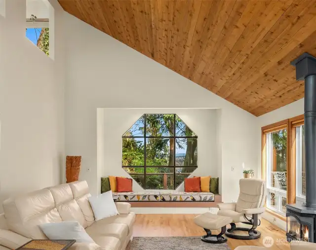 Another shot of the spacious & sunny living room. The gas stove heats the entire main level.