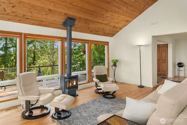 Notice the extension of the zebrawood floors and floor-to-ceiling windows.