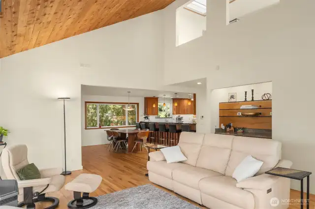 A shot of the living room looking towards the dining room & kitchen.