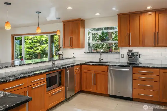 The built-in ice maker is a favorite appliance of the sellers! Notice the gorgeous cabinets here.