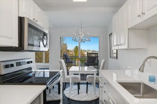 This corner unit is a dream, complete with a fabulous kitchen. There is also a dedicated eating area where you can unwind and marvel at the stunning views of the beach, mountains, and lake.