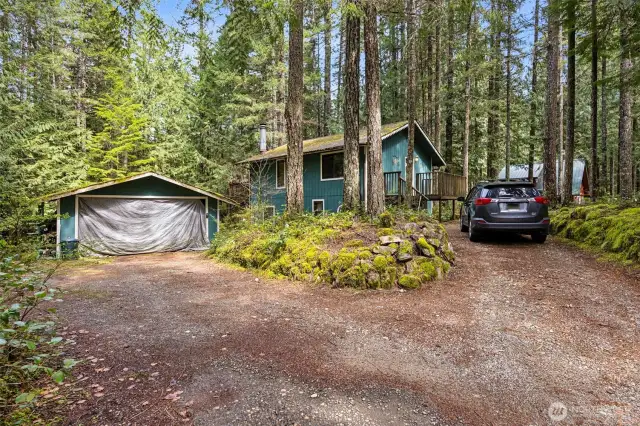 Street view of home and detached carport.