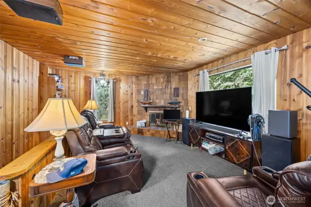 Main level living area with a wood fireplace.